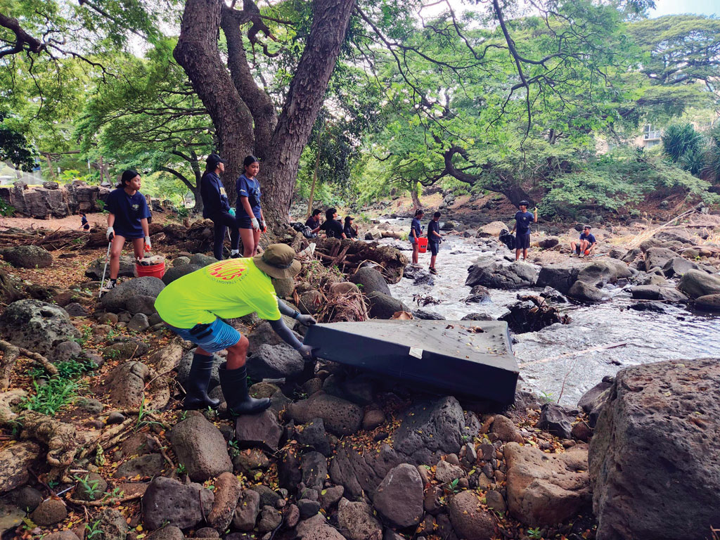Volunteers clean up at Liliʻuokalani Botanical Garden
