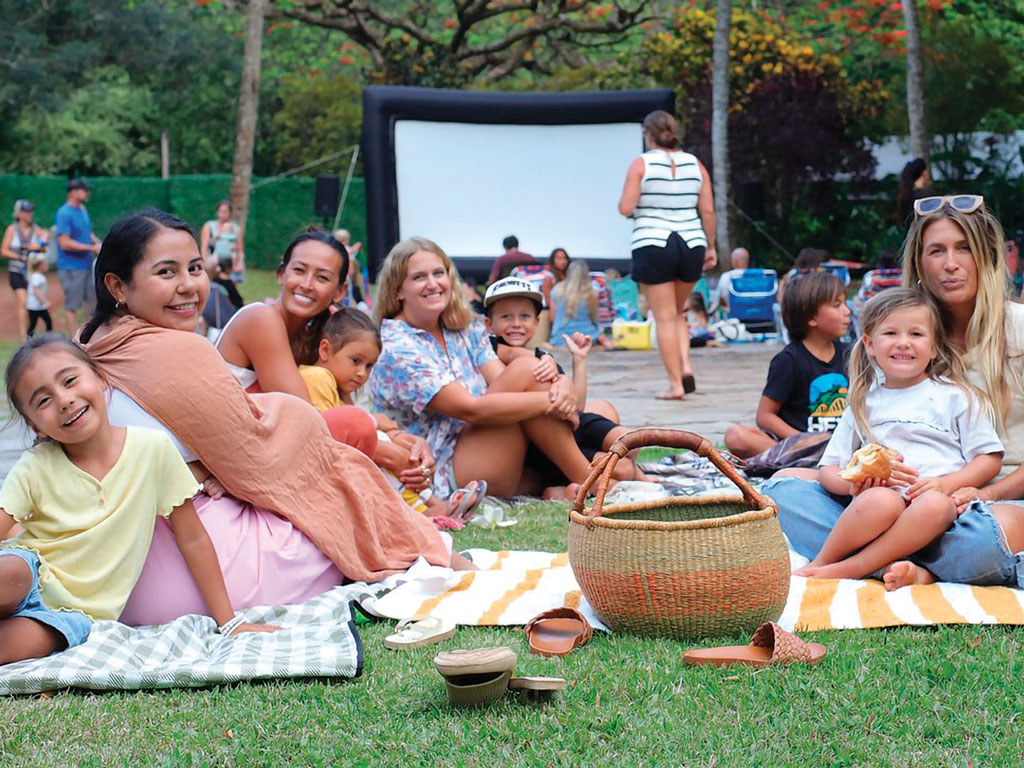 family preparing to watch a movie at Waimea Valley's Screen On The Green